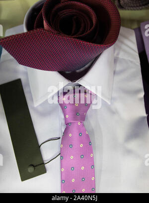 Close up on Mens dress shirt and ties in a clothing store Stock Photo