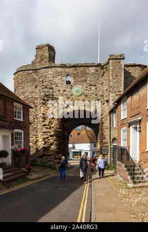 Visitors to Rye in East Sussex look at the Landgare, the last remaining fortified entrance to this historic town, UK Stock Photo