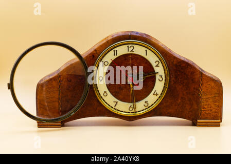 Old italian wooden table clock. Vintage classic clock. Studio shot Stock Photo