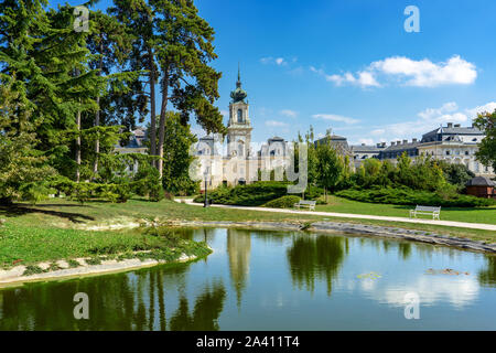 green park with a view of the Beautiful baroque Festetics Castle in Keszthely Hungary reflection in the lake pond Stock Photo