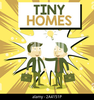 Conceptual hand writing showing Tiny Homes. Concept meaning houses contain one room only or two and small entrance Cheap Businessmen Colleagues with B Stock Photo