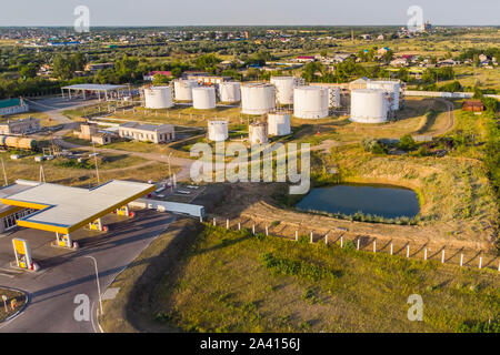 Oil storage photo. Petrol station and petrol tanks in the background. Stock Photo