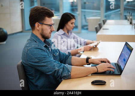 Students studying in a public library. Stock Photo