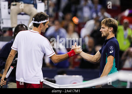 Belgian professional tennis player David Goffin, right, shakes hands with Swiss professional tennis player Roger Federer  during the third round of 2019 Rolex Shanghai Masters, in Shanghai, China, 10 October 2019. Belgian professional tennis player David Goffin was defeated by Swiss professional tennis player Roger Federer with 0-2 at the third round of 2019 Rolex Shanghai Masters, in Shanghai, China, 10 October 2019. Stock Photo