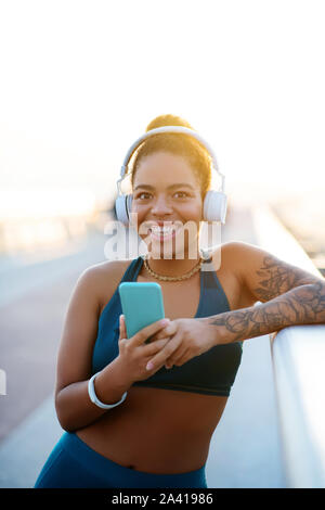 Woman smiling broadly after amazing morning run Stock Photo