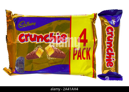 Packet of Cadbury Crunchie chocolate bars with one removed isolated on white background - multipack 4 pack Stock Photo