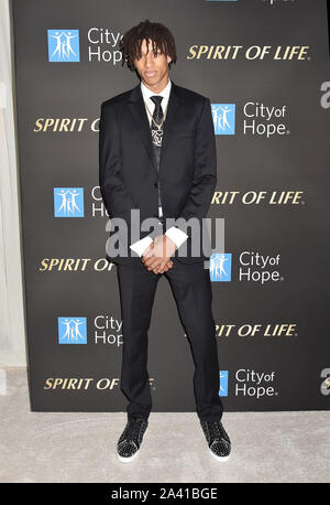 SANTA MONICA, CA - OCTOBER 10: Kofi attends the City Of Hope's Spirit Of Life 2019 Gala at The Barker Hanger on October 10, 2019 in Santa Monica, California. Stock Photo