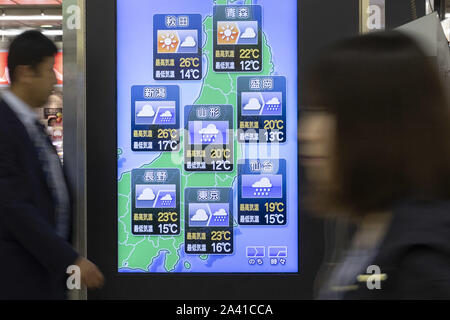 Tokyo, Japan. 11th Oct, 2019. A screen showing today's weather forecast in Japan on display at Shinjuku Station. A powerful Typhoon Hagibis is approaching Japan forcing rail and airline transport companies to suspend the services on Saturday. The East Japan Railway announced this Friday that it will ben stopping their train services in Tokyo from Saturday morning and will continue until at least noon on Sunday. Organizers of the Rugby World Cup has canceled two matches scheduled for the weekend. Credit: Rodrigo Reyes Marin/ZUMA Wire/Alamy Live News Stock Photo