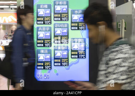 Tokyo, Japan. 11th Oct, 2019. A screen showing today's weather forecast in Japan on display at Shinjuku Station. A powerful Typhoon Hagibis is approaching Japan forcing rail and airline transport companies to suspend the services on Saturday. The East Japan Railway announced this Friday that it will ben stopping their train services in Tokyo from Saturday morning and will continue until at least noon on Sunday. Organizers of the Rugby World Cup has canceled two matches scheduled for the weekend. Credit: Rodrigo Reyes Marin/ZUMA Wire/Alamy Live News Stock Photo