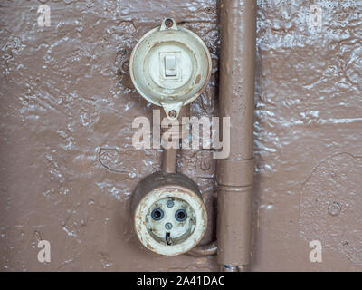 old switch with socket outlet Stock Photo