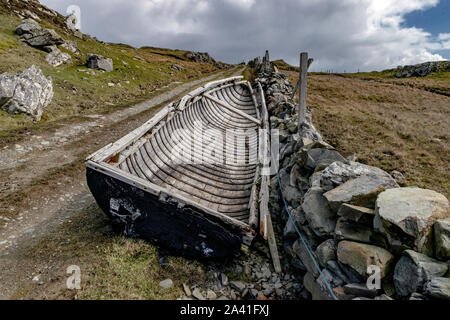 Ireland, Galway Connemara The Island of Inishbofin : 04-2016 Abandoned Currachs, the tar covered  traditional fishing boats found only on the west Stock Photo