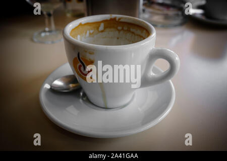 Empty coffee cup on a bar table Stock Photo