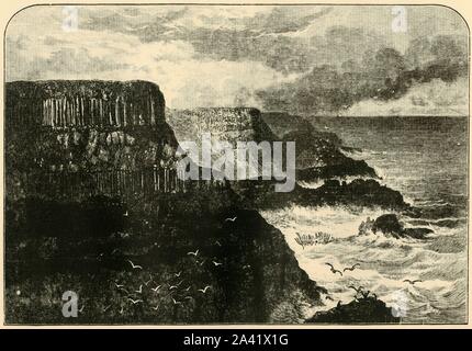'Pleaskin Head, Anrim', 1898. Pleaskin Head on the Atlantic Ocean at the Giant's Causeway in County Antrim with interlocking volcanic basalt columns, is listed as a World Heritage Site. From &quot;Our Own Country, Volume V&quot;. [Cassell and Company, Limited, London, Paris &amp; Melbourne, 1898] Stock Photo