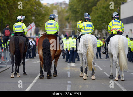 London, UK. Metropolitan mounted police officers on duty in Whgitehall during a protest by Extinction Rebellion, 8th October 2019 Stock Photo