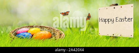 Banner sign Happy Easter with Easter basket Stock Photo
