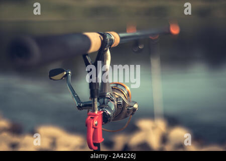 Fishing rod with a blurred background on a beautiful sunny day Stock Photo