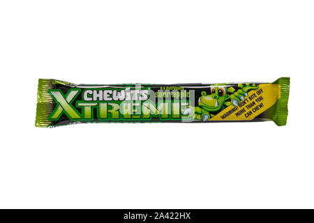 Packet of Extreme Chewits extremely sour apple sweets - Warning don't bite off more than you can chew isolated on white background Stock Photo