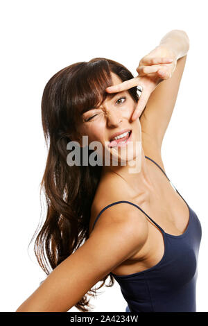 Woman winking and holding her hand over her eyes Stock Photo