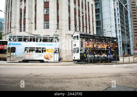 Tram passed by in Causeway Bay road, Hong Kong SAR Stock Photo