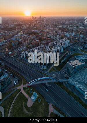 Aerial view of Milan skyline at dawn. Flying over building and boulevard. Stock Photo