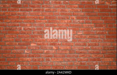 part of a red wall made of red bricks in different shades Stock Photo