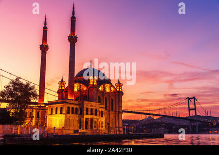 Ortakoy Mosque at purple sunrise, Istanbul, Turkey Stock Photo