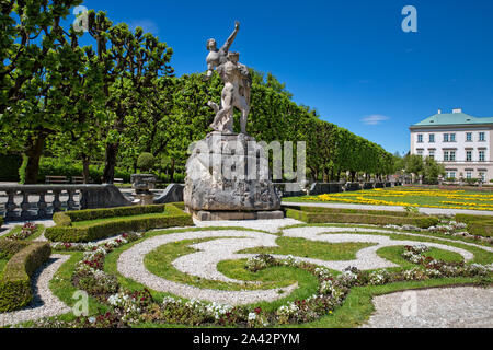 Schloßpark Mirabell in Salzburg town with historical statue showing Hades kidnapping Persephone, Austria Stock Photo