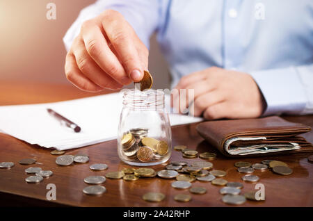 Man doing finances and calculate home budget, saving money, finance Stock Photo