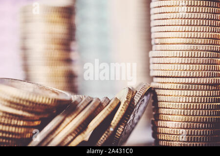 Close up picture of golden coins, shallow depth of field, color toning applied. Stock Photo