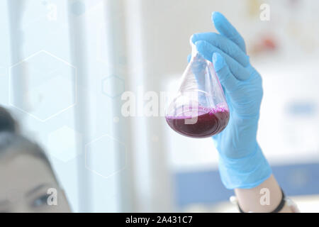 Young African Female Laboratory scientist working at lab with test tubes, test or research in clinical laboratory.Science, chemistry, biology, medicin Stock Photo