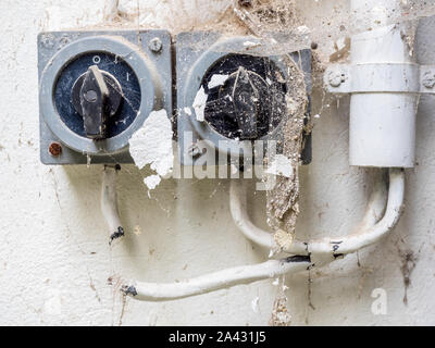 Old switch on a wall Stock Photo