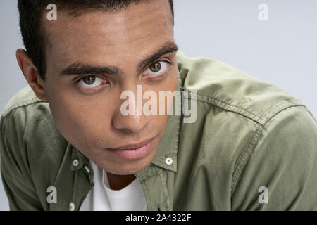Handsome young man being serious and deep in thought Stock Photo