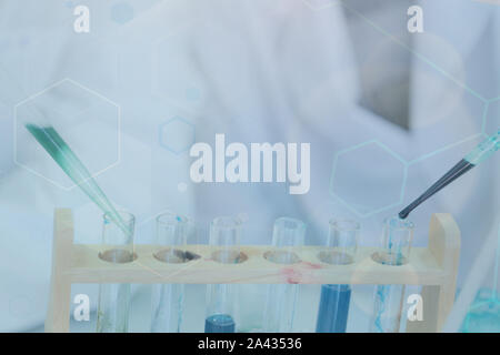 Two young male scientists doing experiments in laboratory Stock Photo