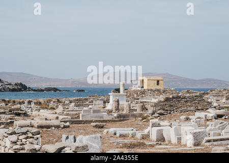 View of the ruins on the island of Delos, Greece, an archaeological site near Mykonos in the Aegean Sea Cyclades archipelago. Stock Photo
