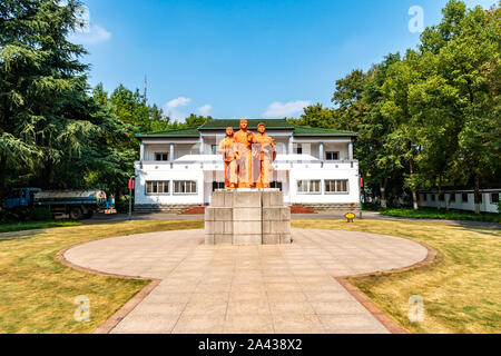 Wuhu Anhui Zheshan Gongyuan Park Statue of Chinese Three Communist Workers in Front of Huishang Museum on a Sunny Blue Sky Day Stock Photo