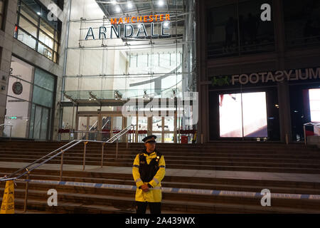 Manchester, England - October 11 2019: Police officers and Forensic Officers investigate the scene as a man stabbed serveral people at a shopping center in Manchester . Credit: Ioannis Alexopoulos/Alamy Live News Stock Photo