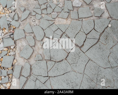 Cracks on the walkway through construction defects Stock Photo