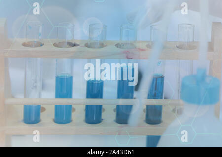 Young Laboratory scientist working at lab with test tubes, test or research in clinical laboratory.Science, chemistry, biology, medicine and people co Stock Photo