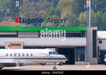 gno, Ticino, Switzerland - 6th October 2019 : View on the Lugano-Agno airport with a parked small airplane located in the Canton of Ticino, Switzerlan Stock Photo