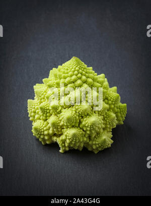 Romanesco broccoli isolated on slate. Stock Photo