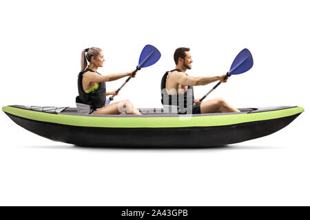 Profile shot of a young man and woman kayaking isolated on white background Stock Photo