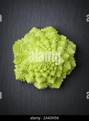 Romanesco broccoli isolated on a stone slab. Stock Photo