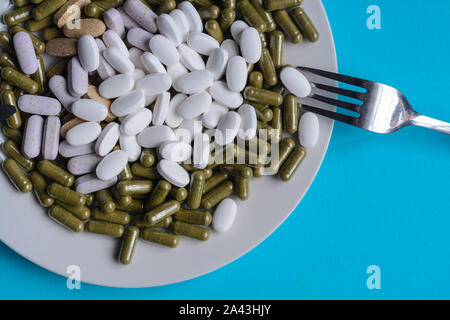 Medical pills representing the concept about abuse and addiction of drugs Stock Photo