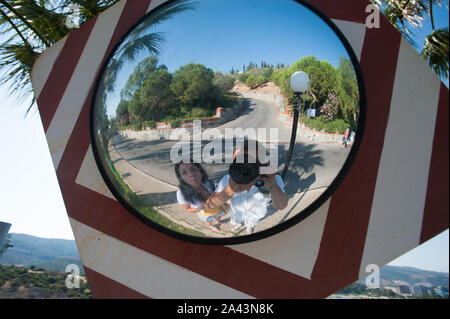 Tourists on vacation take pictures. Tourists take pictures of themselves in the mirror on the camera. Stock Photo