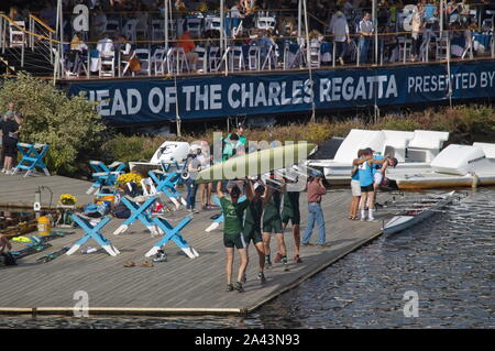 Boston, MA / USA - October 22, 2019: Men's four on the Harvard boathouse dock, flipping their boat Stock Photo