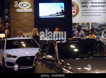 Orlando, Florida, USA. 21st Sep, 2019. People look at a display of Hyundai vehicles during the 2019 Central Florida International Auto Show at the Orange County Convention Center.Hyundai and Kia announced on October 11, 2019 that they have agreed to settle a class action lawsuit over engine fires by paying customers who purchased certain Hyundai and Kia models a total of $760 million. Credit: Paul Hennessy/SOPA Images/ZUMA Wire/Alamy Live News Stock Photo