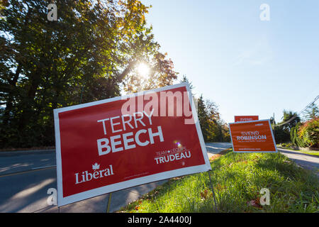 NORTH VANCOUVER, BC, CANADA - OCT 10, 2019: MP candidate signs beside the road rallying for voter support for their party in the upcoming Canadian Stock Photo