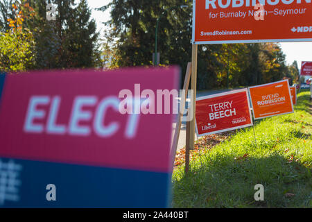 NORTH VANCOUVER, BC, CANADA - OCT 10, 2019: MP candidate signs beside the road rallying for voter support for their party in the upcoming Canadian Stock Photo