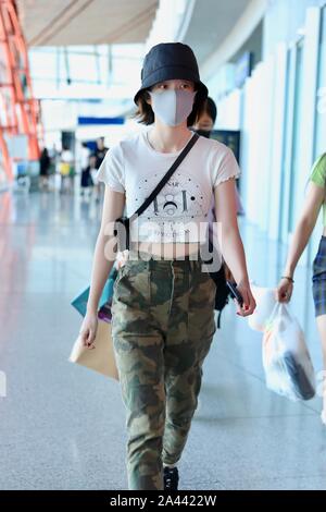 Chinese actress Zhang Xueying, also known as Sophie Zhang, arrives at the Shanghai Hongqiao International Airport before departure in Shanghai, China, Stock Photo