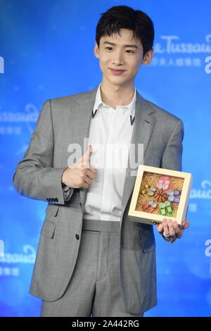 Chinese actor Bai Jingting attends an unveiling ceremony for his own wax figure at the Madame Tussauds museum in Beijing, China, 20 August 2019. Stock Photo